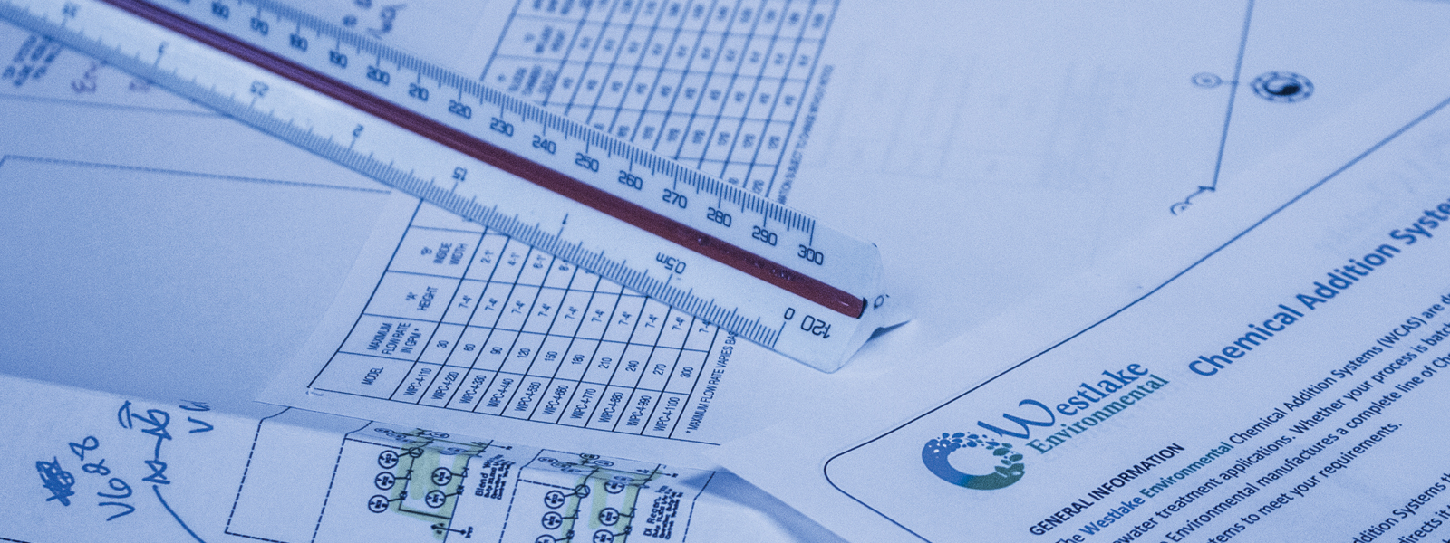 Medium close up of Westlake Environmental Engineering print with triangle ruler, focused on Westlake Environmental and Chemical Addition System, with blue wash